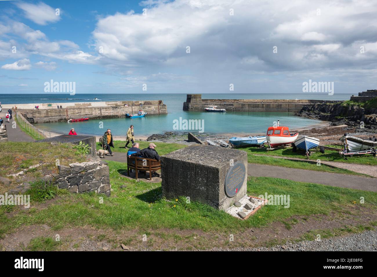 Craster Northumberland coast, view in summer of people visiting the scenic harbour in Craster on the Northumberland coast, England, UK Stock Photo