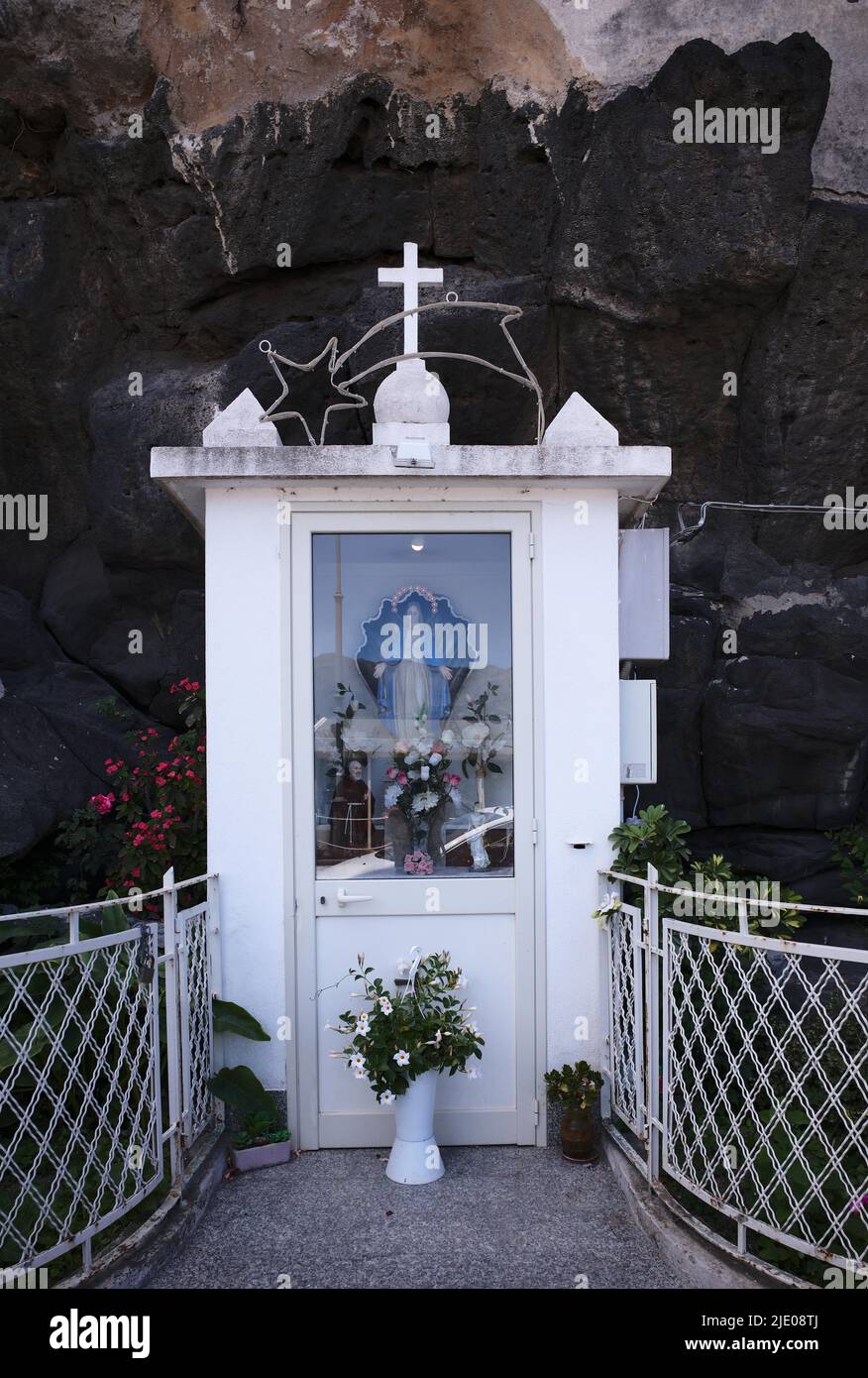 Marian shrine, statue of the Virgin Mary, Madonna figure in volcanic rock, Giardini-Naxos, Sicily, Italy Stock Photo