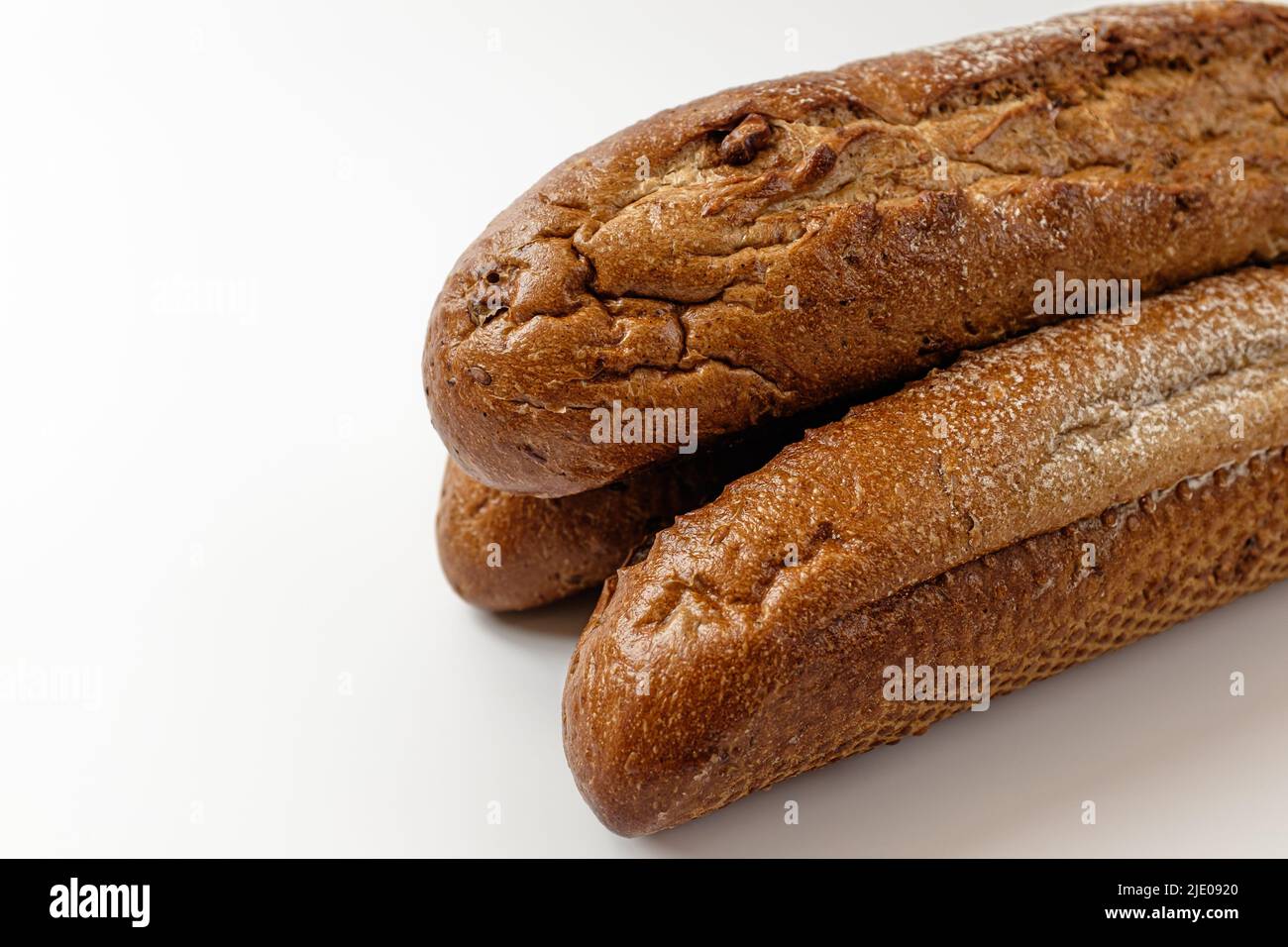 whole grain baguette on a white background Stock Photo - Alamy