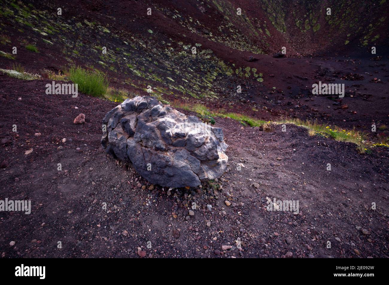 Red lava stones, volcanic soil, Crateri crater Silvestri, Etna volcano, Sicily, Italy Stock Photo