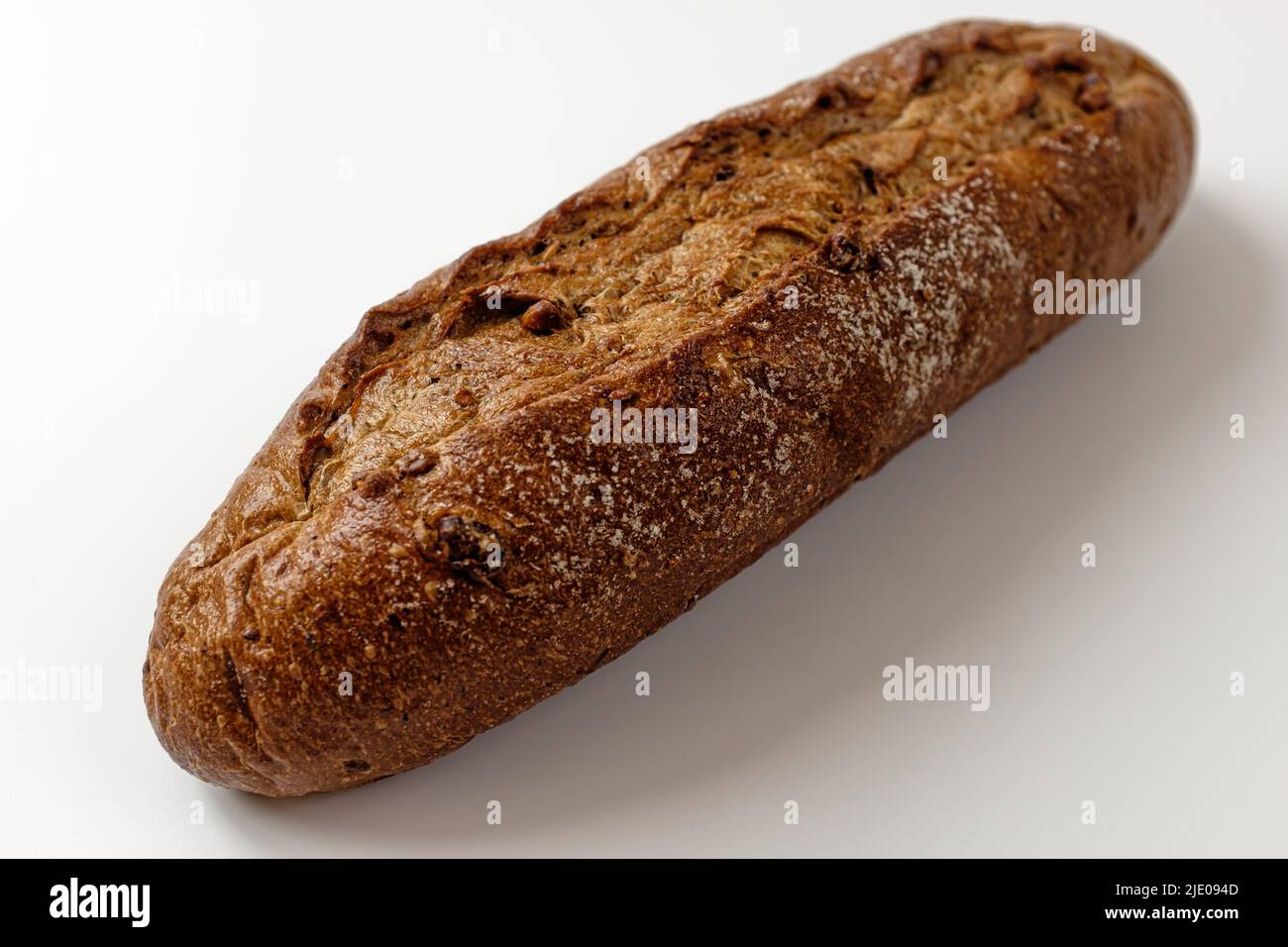 whole grain baguette on a white background Stock Photo - Alamy