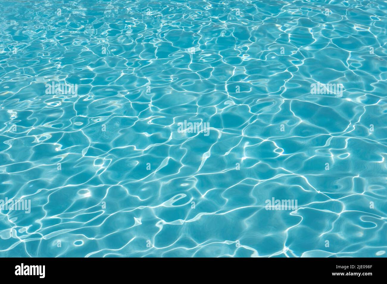 Swimming pool water ripples background, clean blue seiche waves in a spacious outdoor piscina, concept for summer vacation mood Stock Photo