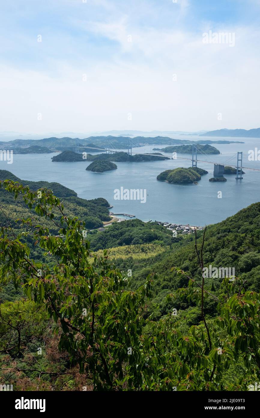 A view of Japan's Kurushima Kaikyō Bridge, which connects the island of Ōshima to Shikoku. The bridge passes over the Inland Sea (Seto Naikai). Stock Photo