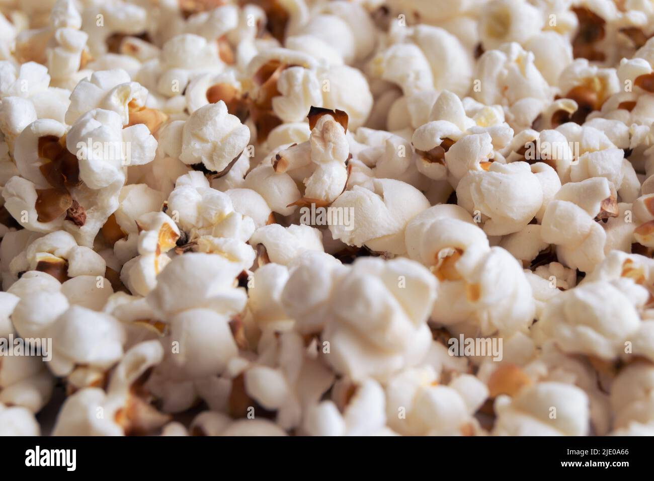 Heap of delicious popcorn isolated on a white background. Scattered