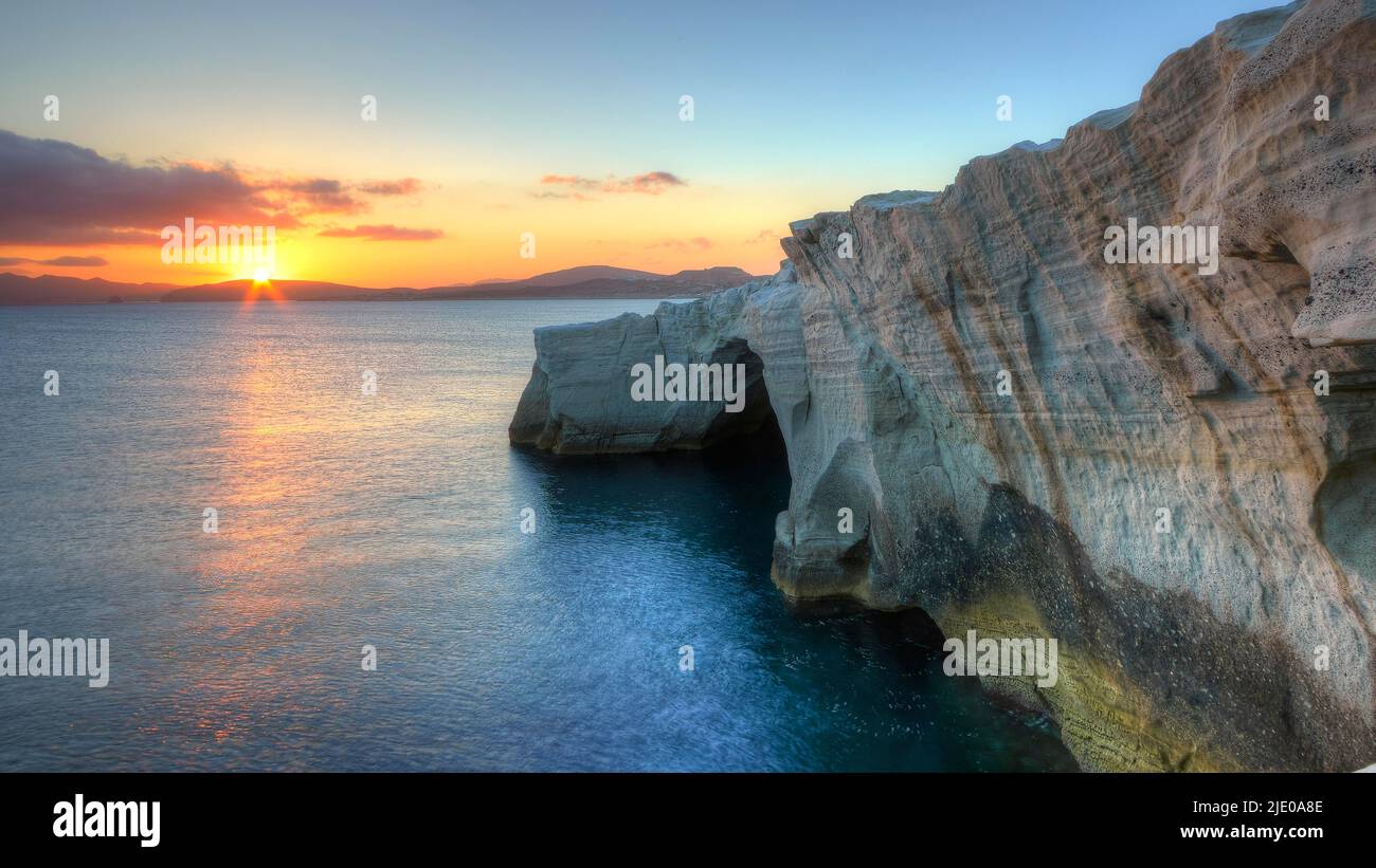 Morning light, sunrise, sun as a star, orangered sky, dark blue calm