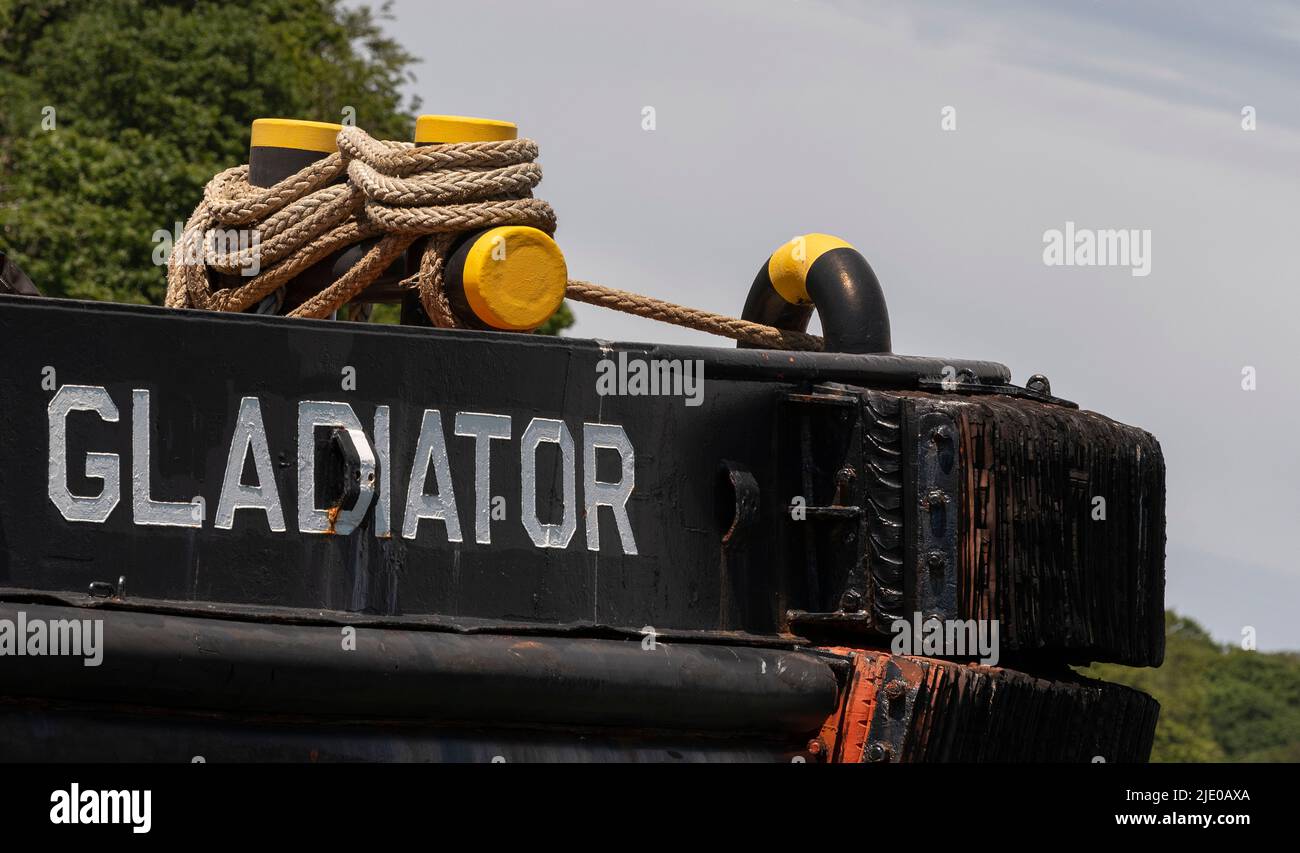 Cornwall, England, UK. 2022. The Gladiator built 1975 538 tons, a tug boat laid up on the River Fal in Cornwall, UK. Nameplate and bouy ropes. Stock Photo