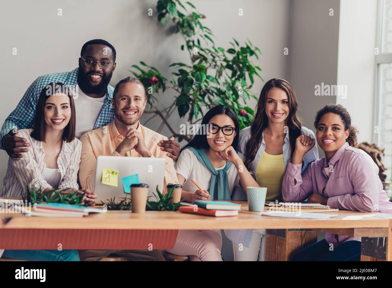 Photo of positive happy businessman businesswoman working modern device