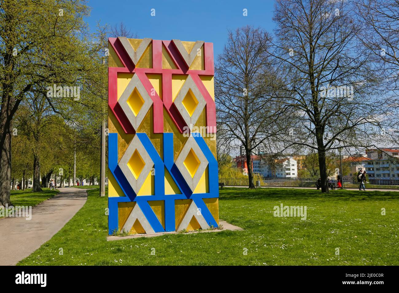 Art in public space, sculpture Multiples Element 71 2 by Otto Herbert Hajek, large sculpture, blue, red, yellow, gold-coloured, Ulm Stock Photo
