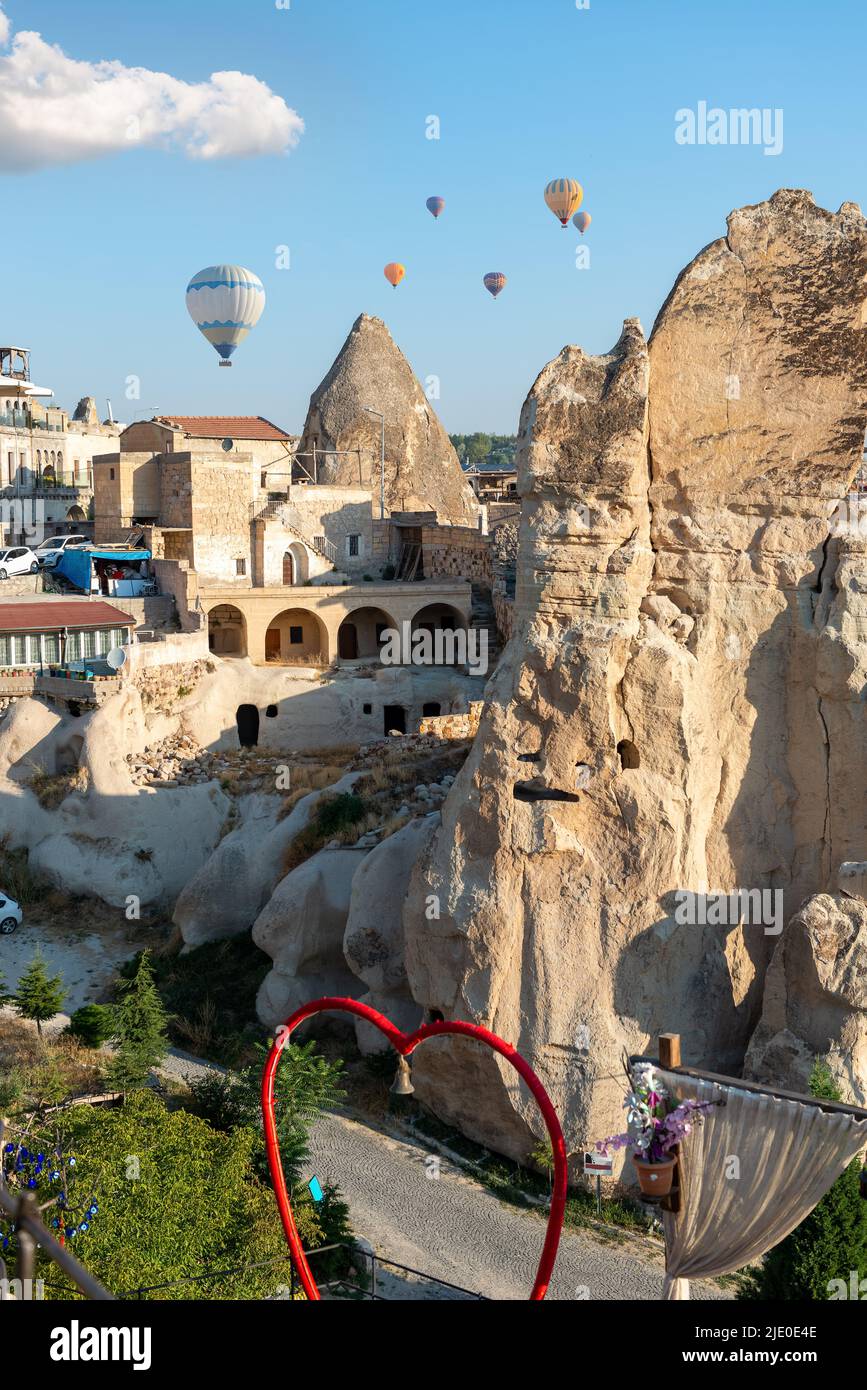 Hot air balloons over rocks in Cappadocia Stock Photo