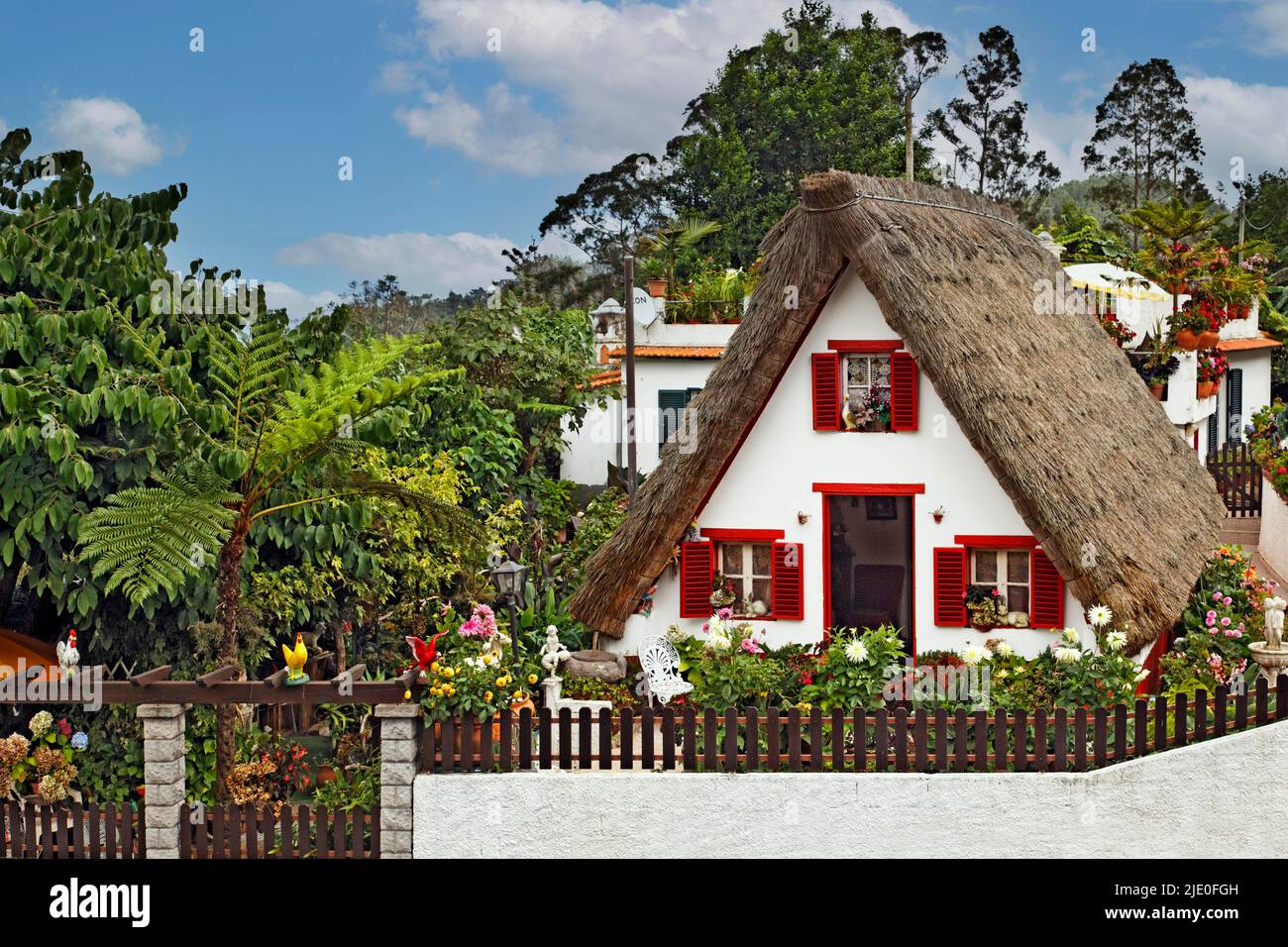 Casa de Como, thatched house, stone house, gable roof, steep, reaching to the ground, house with thatched roof, thatched roof, small, colourful Stock Photo