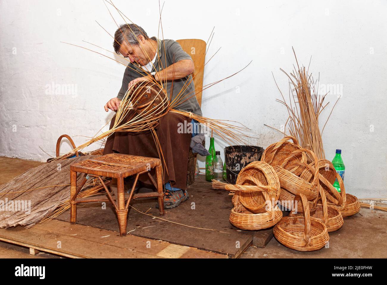 Basket maker, basket weaver, basketry, wicker rod, show workshop, workshop, Cafe Relogio, Camacha, Madeira, officially Autonomous Region of Madeira Stock Photo