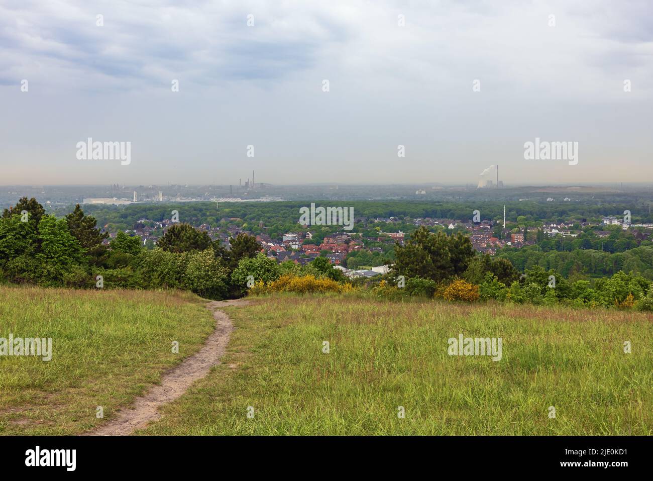 Overview of the Ruhr area from the Halde Haniel with several heavy industries on the horizon Stock Photo