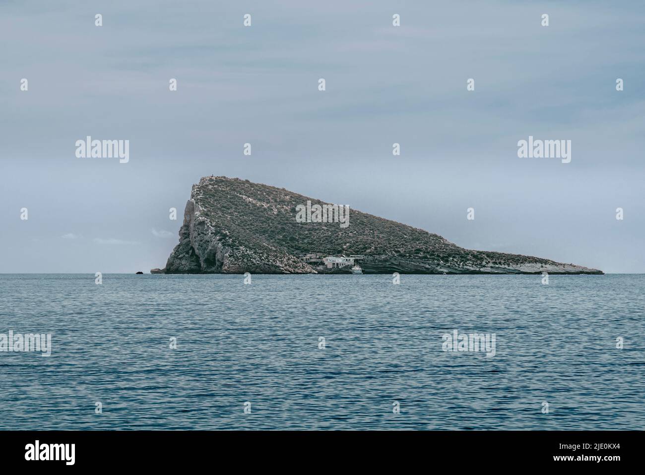 The island or islet of Benidorm or island of journalists, located off the coast with high ecological, landscape and environmental interest., Alicante. Stock Photo