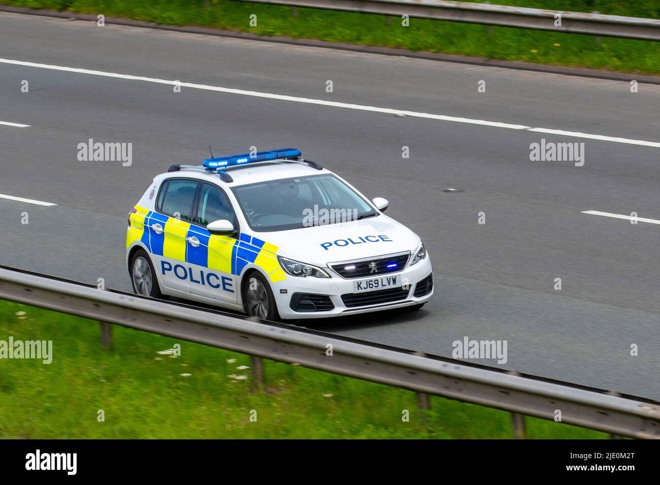 2020 Police Highway Patrol Peugeot 308 Access Bluedi S/S start stop Diesel 1498cc hatchback; travelling on the M61 Motorway, Manchester, UK Stock Photo