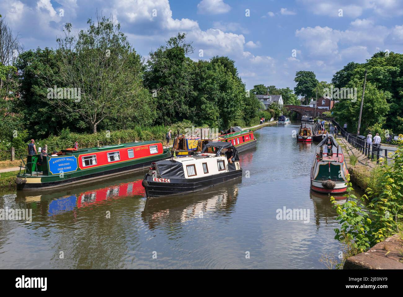 Brightly decorated canal narrowboats on the Bridgewater canal at Lymm ...