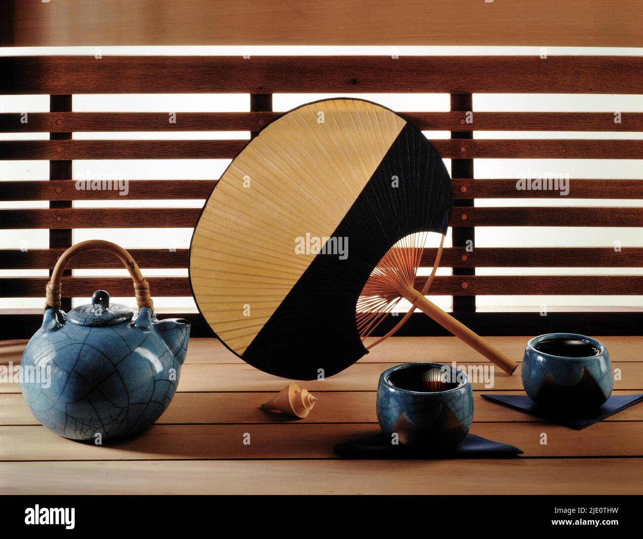 Cups of tea and Japanese fan. Stock Photo
