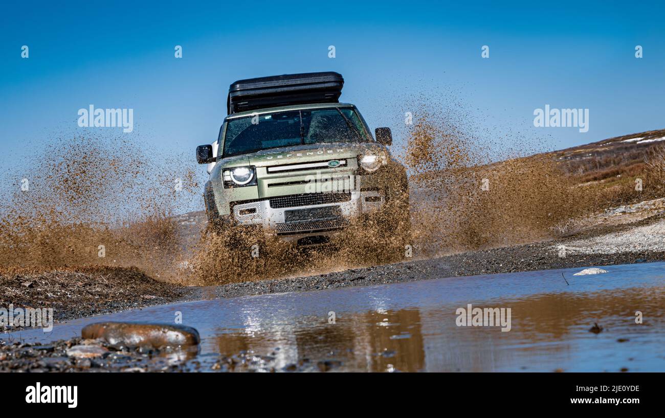Rybachy, RUSSIA - May 30 2022: Off-roading New Land Rover Defender. The Land Rover Defender is a series of British off-road cars and pick-up trucks. Stock Photo