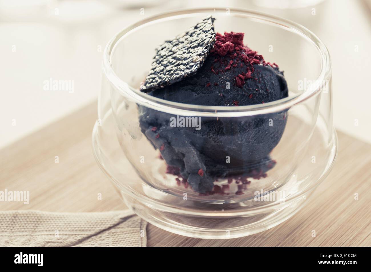 Bowl of tofu based ice cream with black sesame seed. Plant based an fully vegan Stock Photo