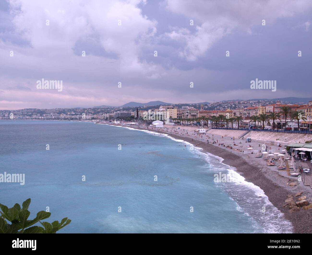 Turquoise color water, mild temperature, blue sky and dramatic clouds