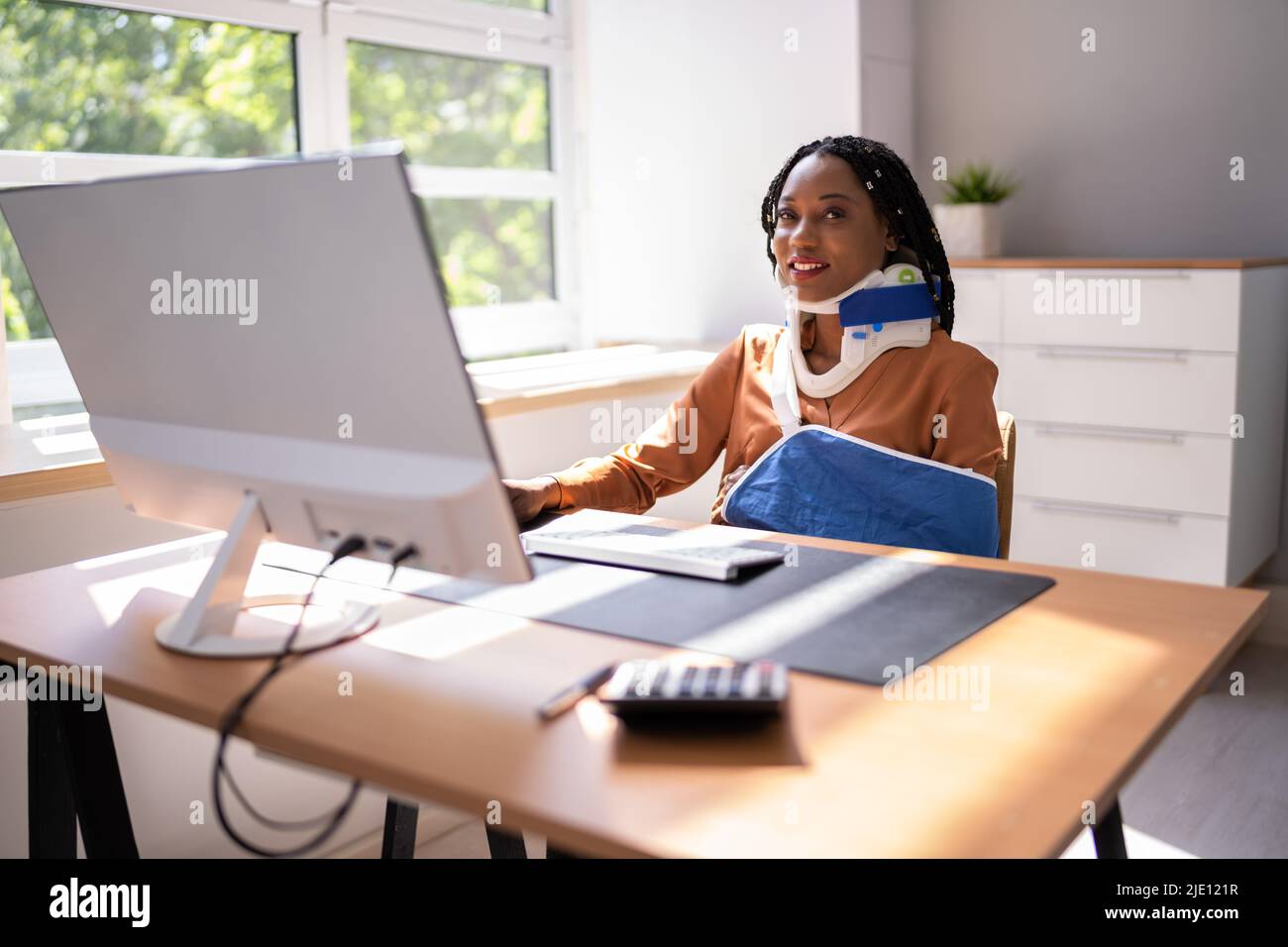 Portrait Of Young Disabled African Businesswoman Working In Office ...
