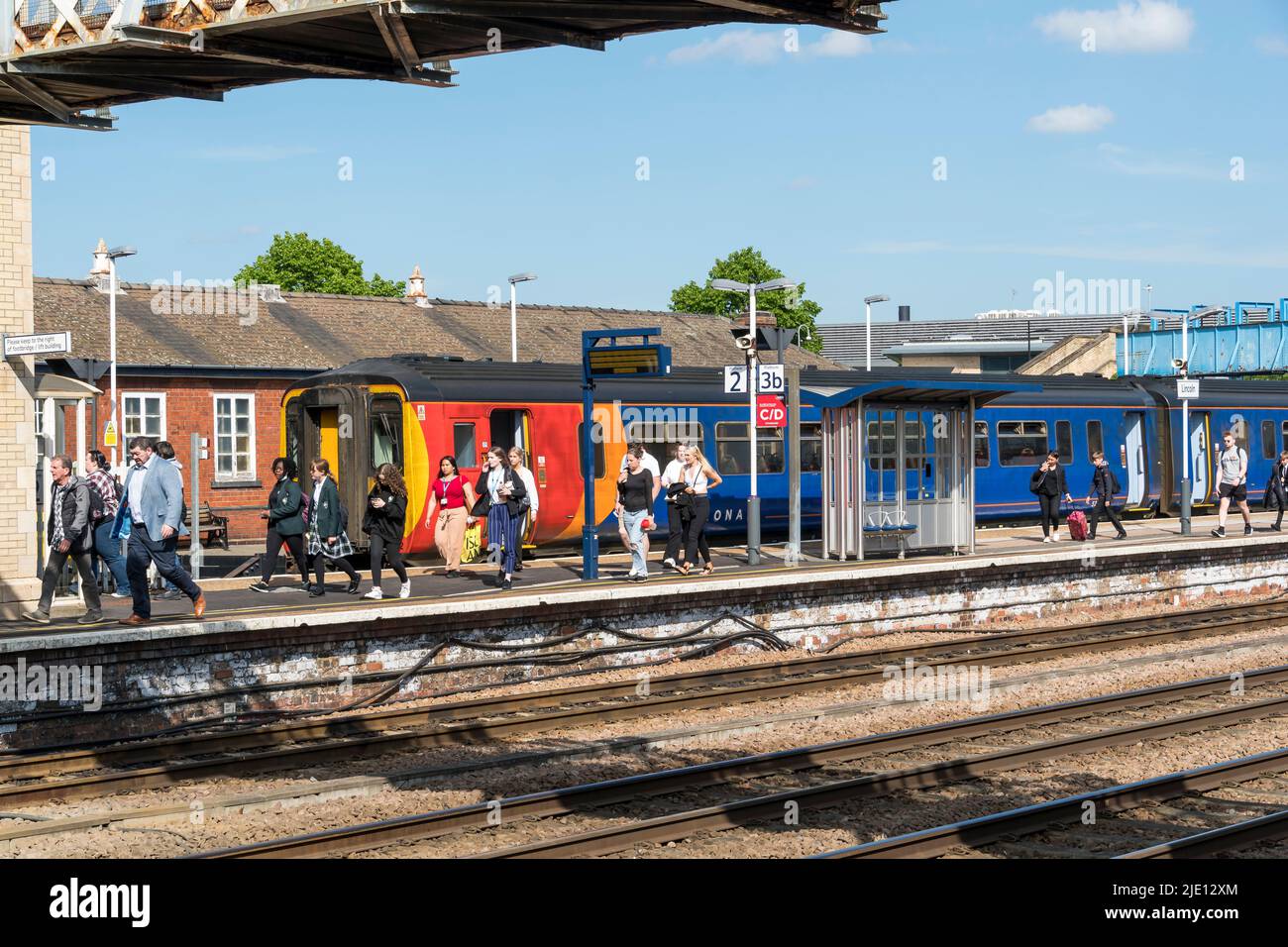 People disembarking from newly arrived train at platform 2 Lincoln railway station 2022 Stock Photo