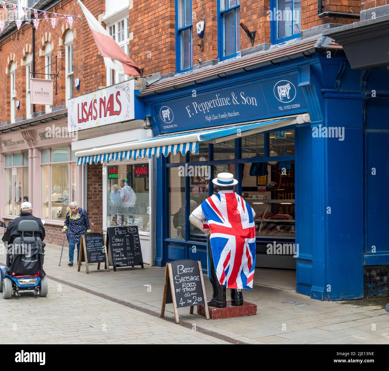 Butchers advertising dummy wearing union jack flag Sincil street Lincoln city 2022 Stock Photo