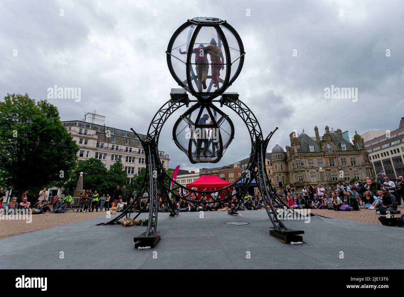 Birmingham, UK. 24th June, 2022. Performers use their unique and dynamic style of dance in a 7m long egg timer, as part of Timeless by Joli Vyan. The performance is part of Birmingham International Dance Festival which takes place in Birmingham city centre. Credit: Peter Lopeman/Alamy Live News Stock Photo