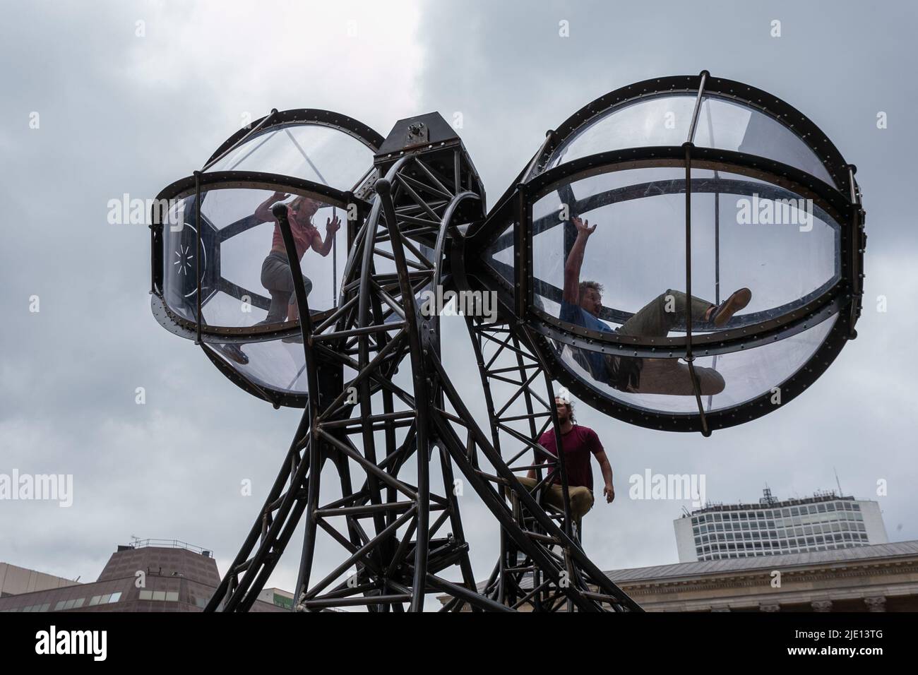 Birmingham, UK. 24th June, 2022. Performers use their unique and dynamic style of dance in a 7m long egg timer, as part of Timeless by Joli Vyan. The performance is part of Birmingham International Dance Festival which takes place in Birmingham city centre. Credit: Peter Lopeman/Alamy Live News Stock Photo