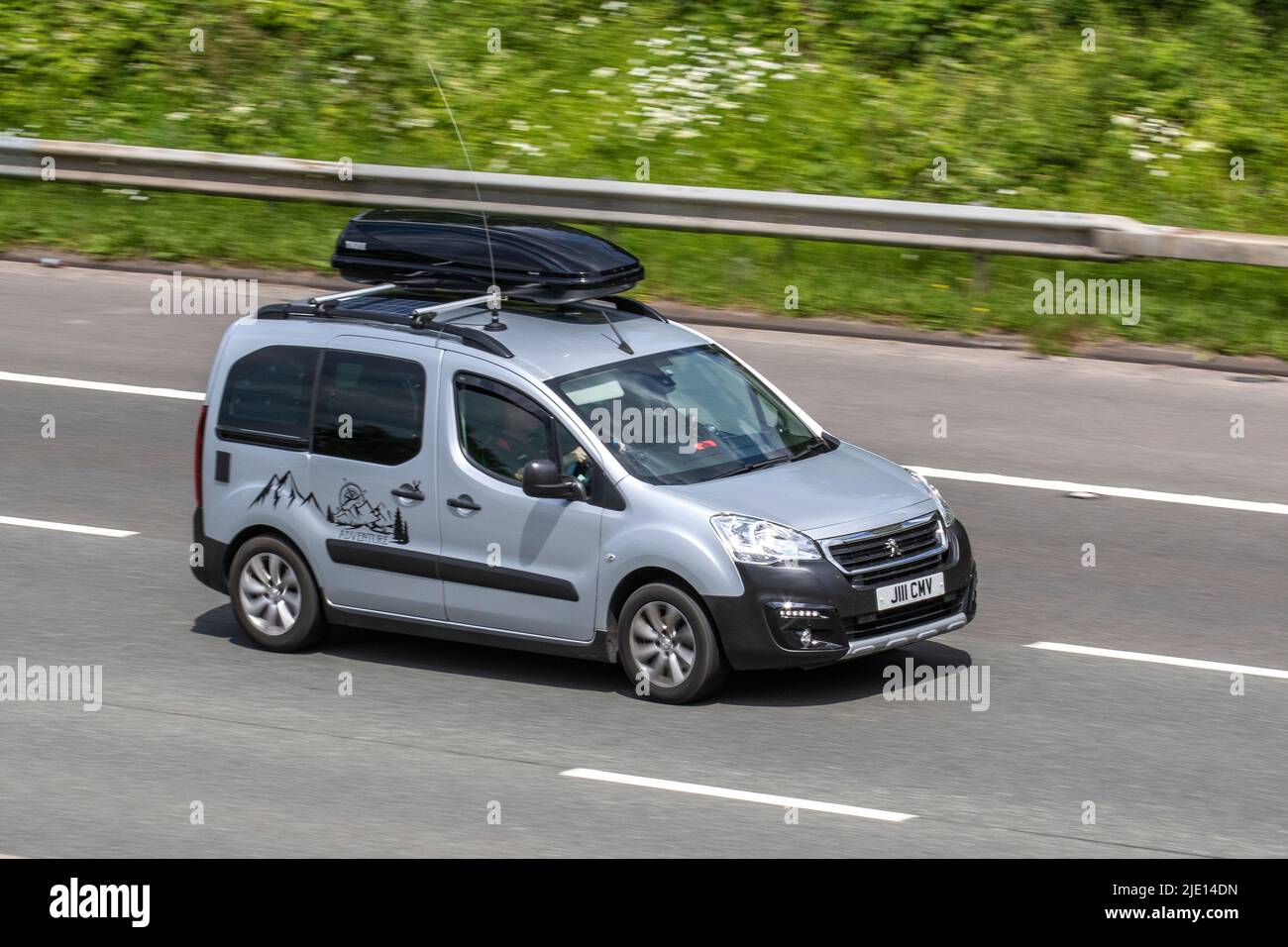 2018 silver Peugeot Partner Tepee Outdoor Adventure Bhdi S/S Bluehdi 120 DPF small MPV diesel 1560cc; travelling on the M61 Motorway, Manchester, UK Stock Photo