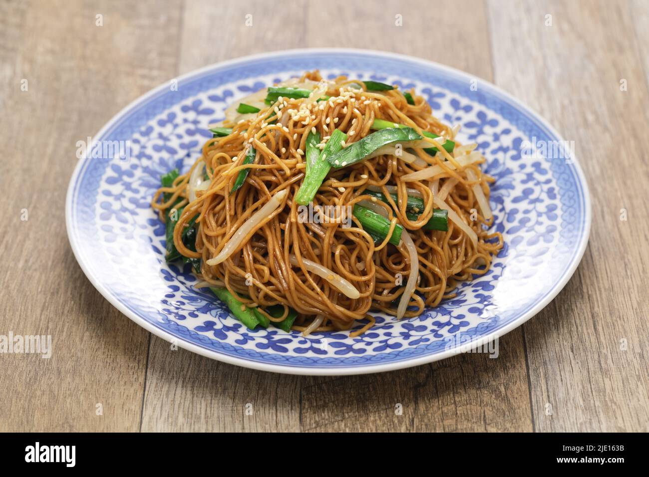 Hong Kong style soy sauce fried noodles( chow mein ) isolated on white