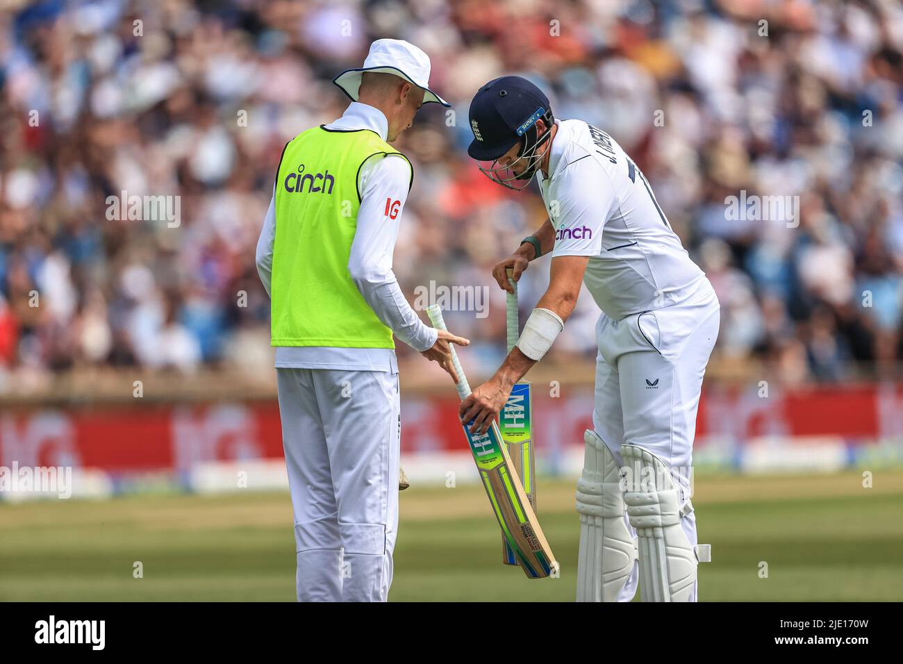 Jamie Overton of England swaps bats during the game Stock Photo