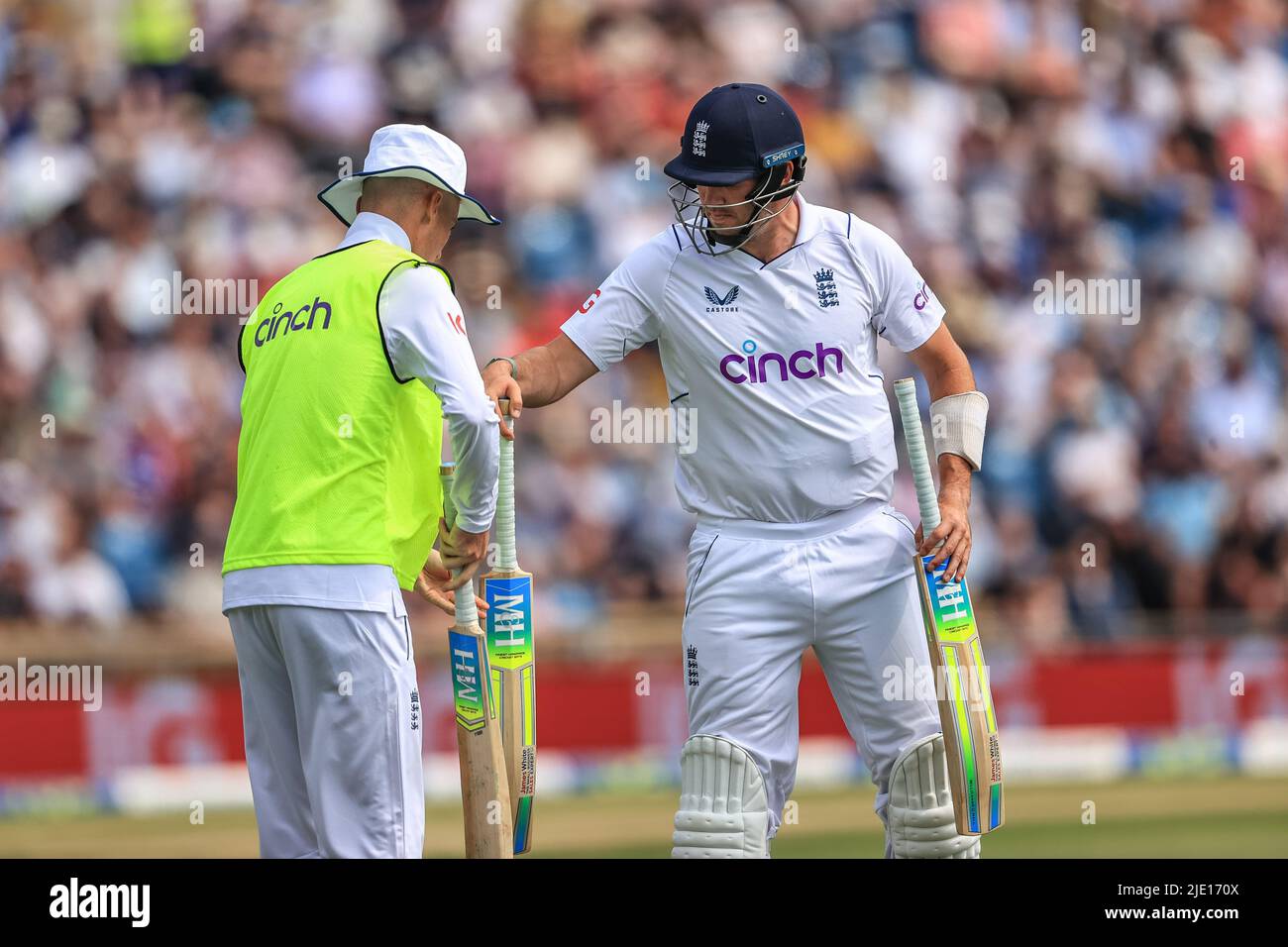 Jamie Overton of England swaps bats during the game Stock Photo