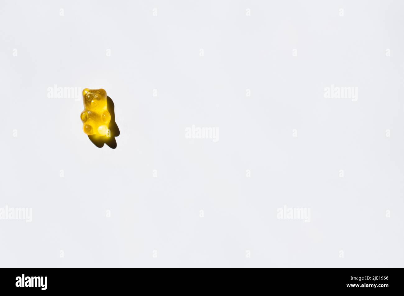 Top view of yellow gummy bear on white background Stock Photo