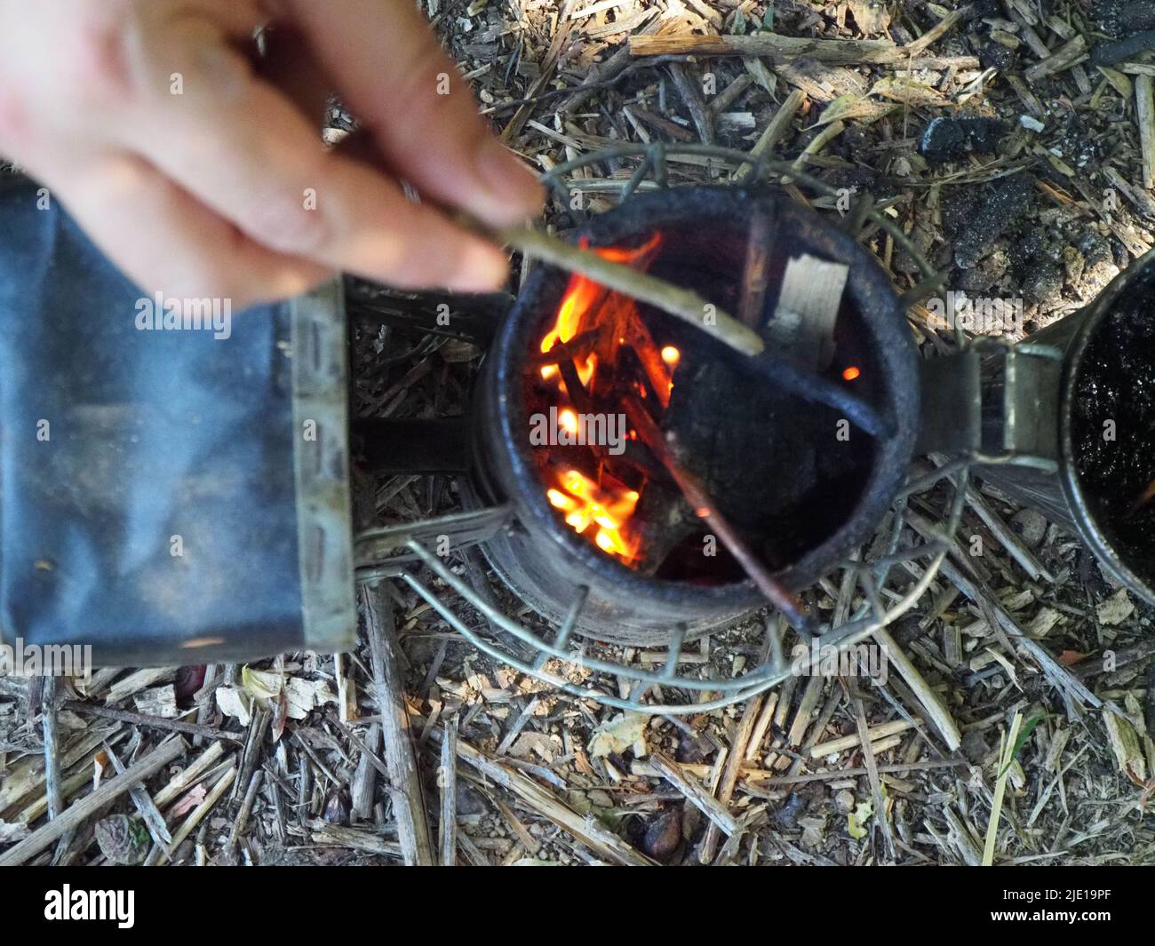 starting a bee smoker before harvesting honey hives in the farm Stock