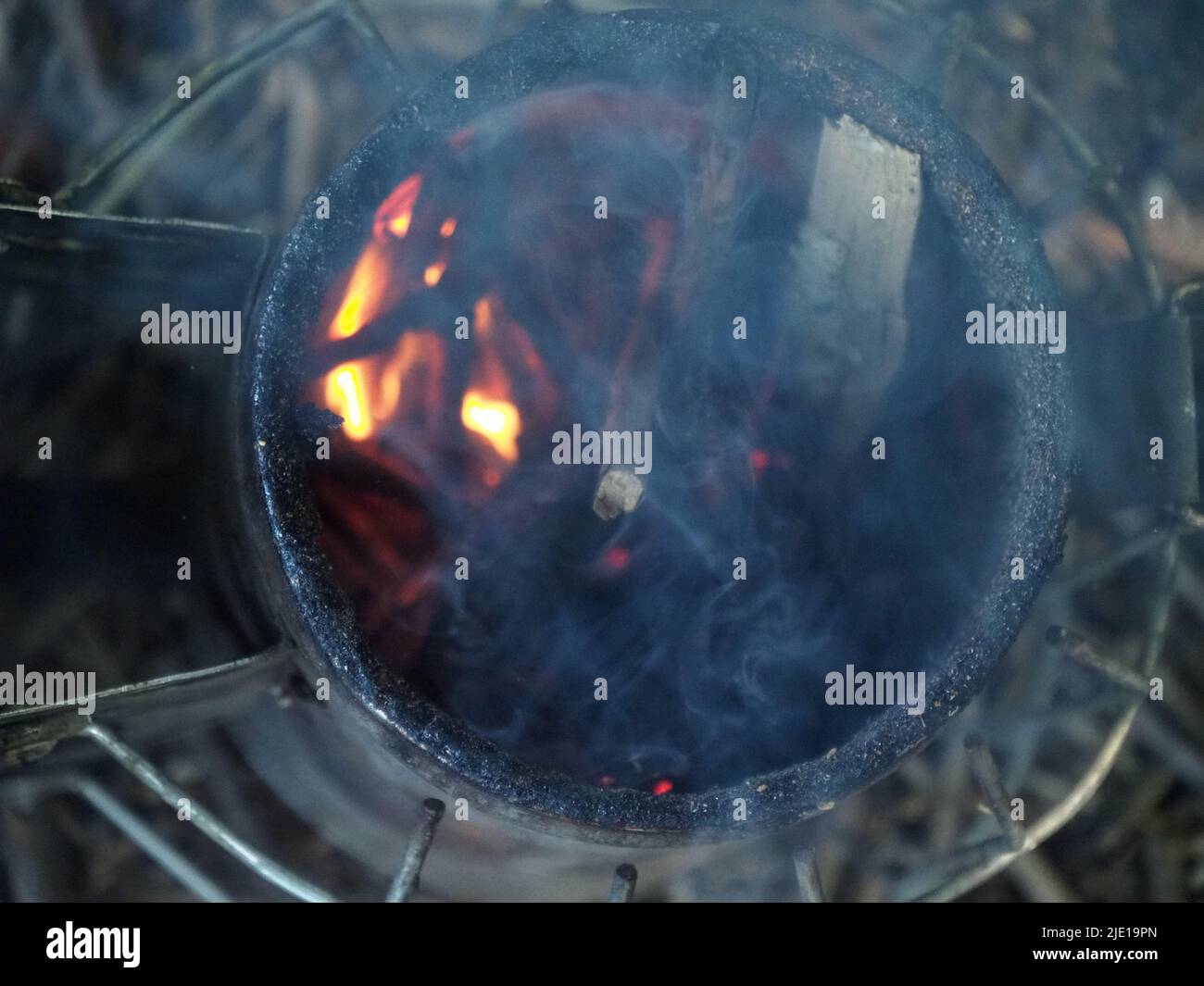 starting a bee smoker before harvesting honey hives in the farm Stock