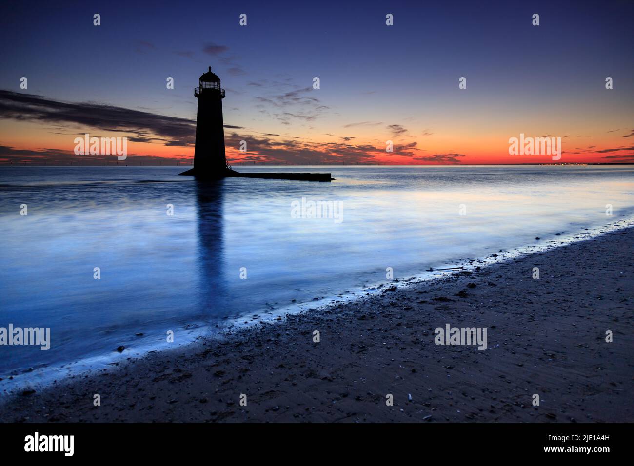 Dawn over Talacre lighthouse on the North Wales coast Stock Photo
