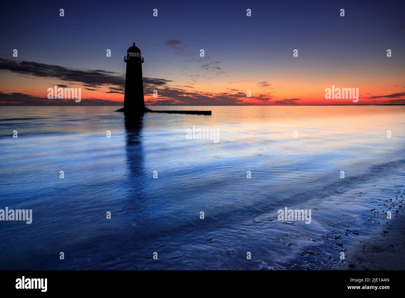 Dawn over Talacre lighthouse on the North Wales coast Stock Photo