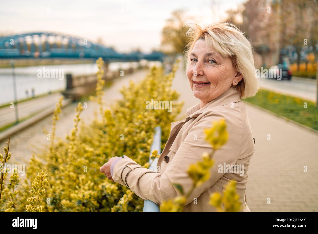 Outdoor portrait of beautiful and elegant middle age 55 60 year old
