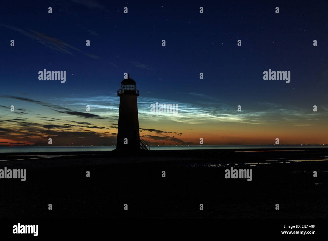 Noctilucent clouds over Talacre lighthouse, North Wales Stock Photo