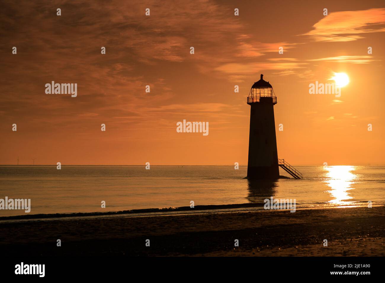 Sunrise over Talacre lighthouse on the North Wales coast Stock Photo
