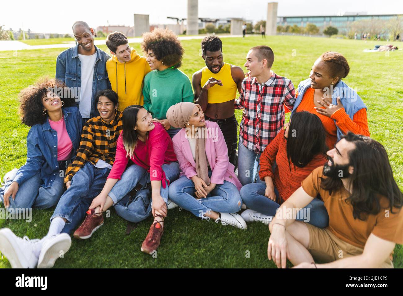 Group of young multiracial friends having fun together in park - Friendship and diversity concept Stock Photo