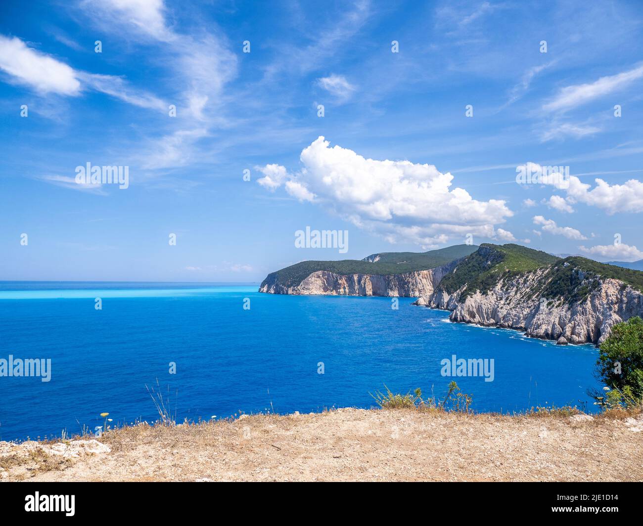 View of the coast of Cape Lefkatas or Doukato from the site of the Temple of Apollo whose stones were cleared to build a lighthouse - Lefkada Greece Stock Photo