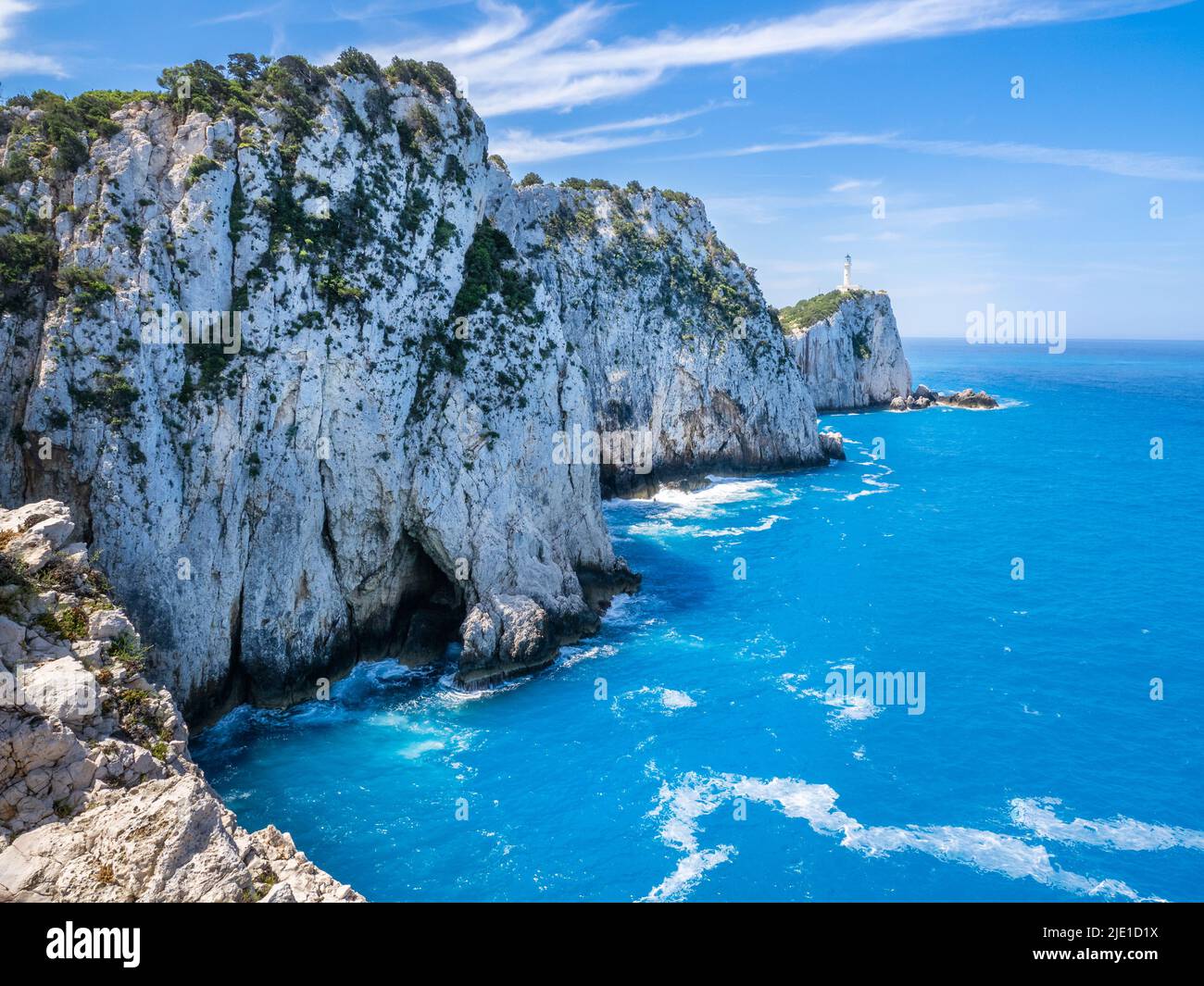 Lighthouse on white cliffs of Cape Lefkatas or Doukato site of the Temple  of Apollo whose stones were cleared to build the structure - Lefkada Greece  Stock Photo - Alamy