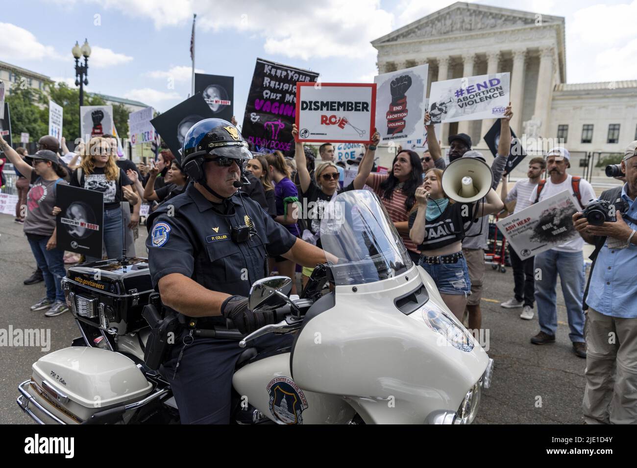 Washington, United States. 24th June, 2022. US Capitol Hill Police gather as protesters debate in front of the U.S. Supreme Court in Washington, DC on Friday, June 24, 2022. The Supreme Court overturned Roe vs Wade, by a vote of 6-3, eliminating the constitutional right to an abortion after 50 years after the decision. Photo by Tasos Katopodis/UPI Credit: UPI/Alamy Live News Stock Photo