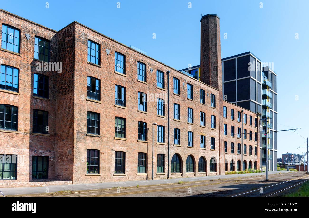 The Crusader Mill and Phoenix apartments development, Piccadilly East, Manchester, England, UK.  A former textile mill with a modern extension. Stock Photo