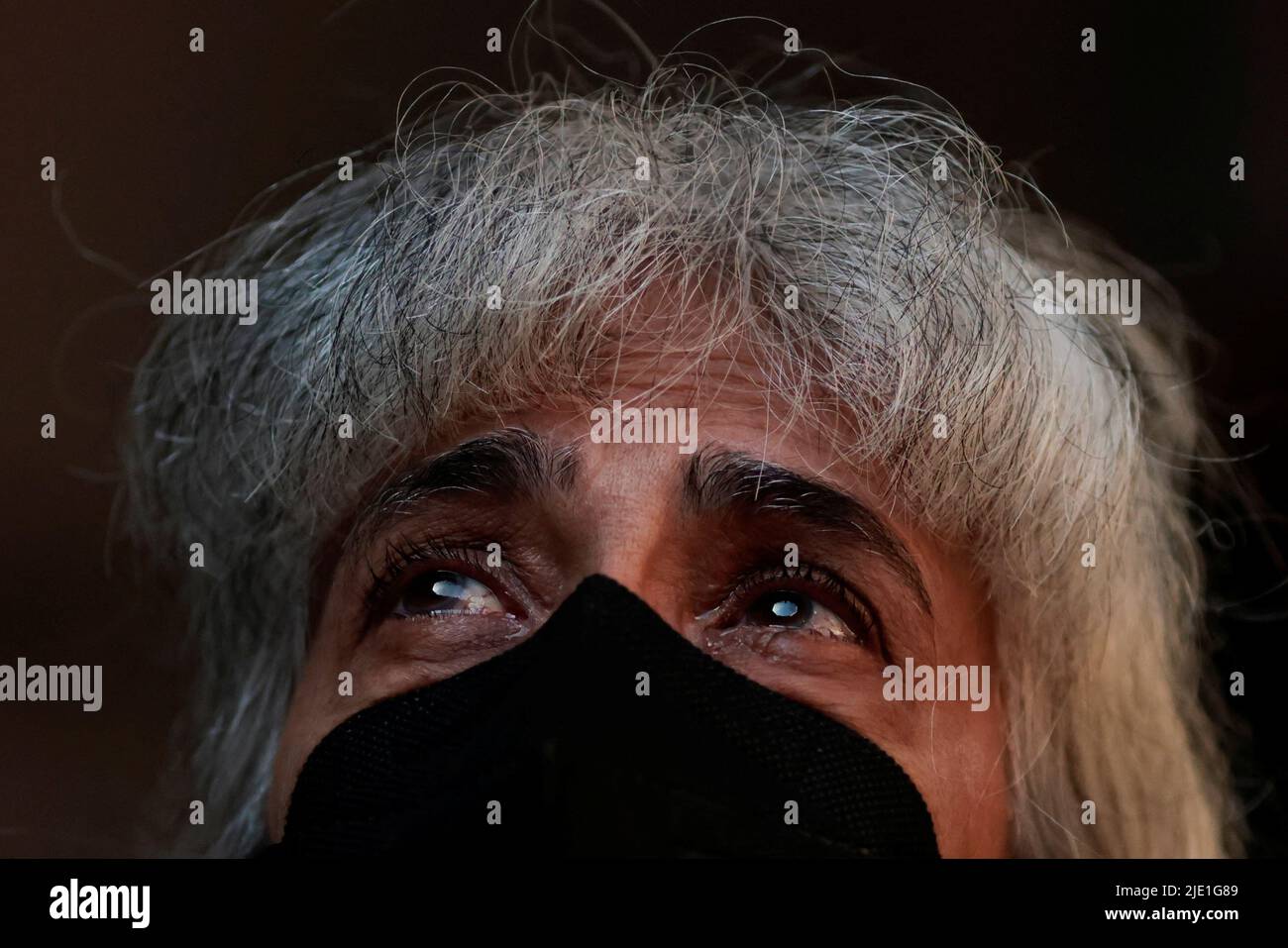 A woman reacts during an ecumenical act organized in honor of the indigenous expert Bruno Pereira and journalist Dom Phillips, who were murdered in the Amazon, in Brasilia, Brazil June 24, 2022. REUTERS/Ueslei Marcelino Stock Photo