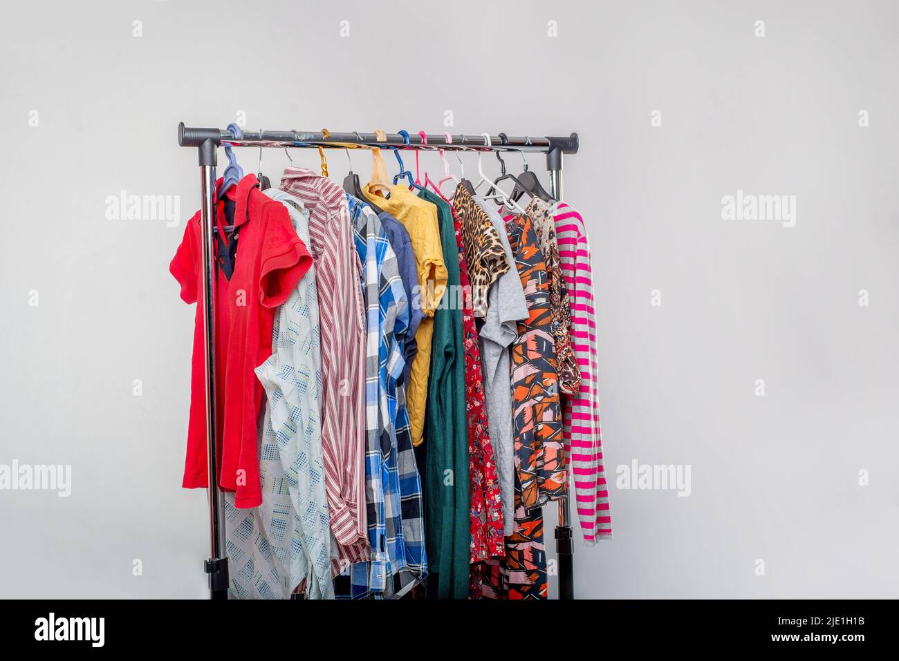 Various secondhand clothes from the wardrobe on the rack Stock Photo Alamy