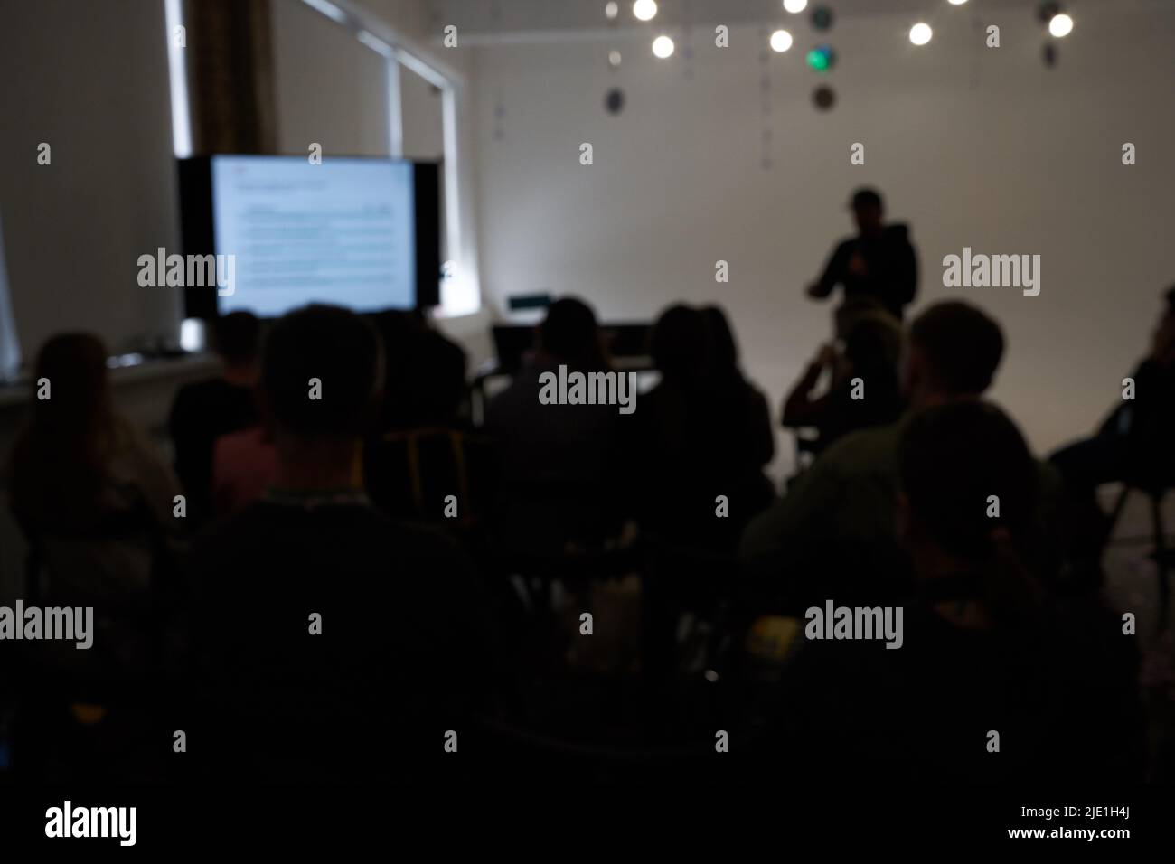 Blurred background of the business conference, one man on the stage, presentation of the project, public talk. High quality photo Stock Photo