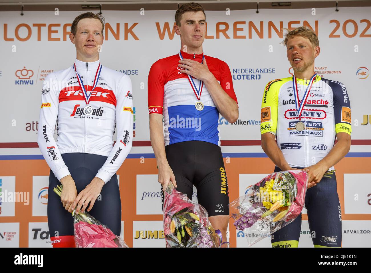 Drenthe, Netherlands. 24th June 2022. EMMEN - Cyclists Daan Hoole (second), Pascal Eenkhoorn (first) and Taco van der Hoorn (third) after the National Championships Cycling in Drenthe. ANP BAS CZERWINSKIA Credit: ANP/Alamy Live News Stock Photo