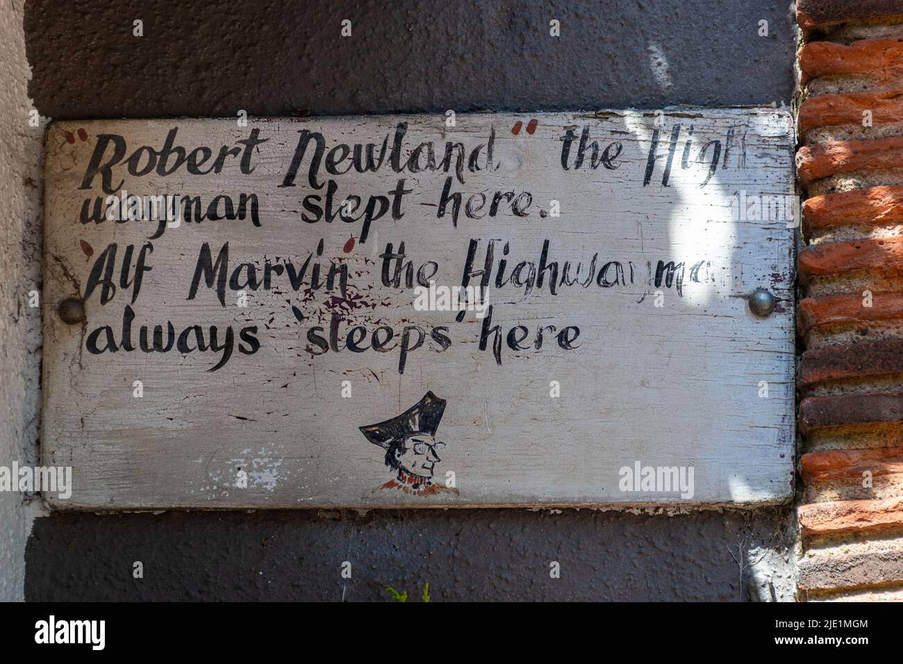 The Bulls Head pub in West Clandon village, Surrey, England, UK. Sign stating Robert Newland the highwayman slept here. Stock Photo